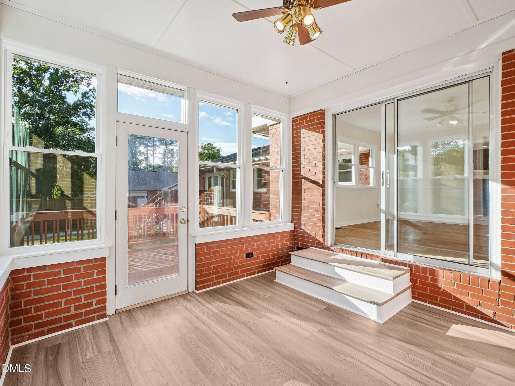 6421 King Lawrence Road Raleigh, NC 27607 - Photo 8 of 52 sunroom into kitchen