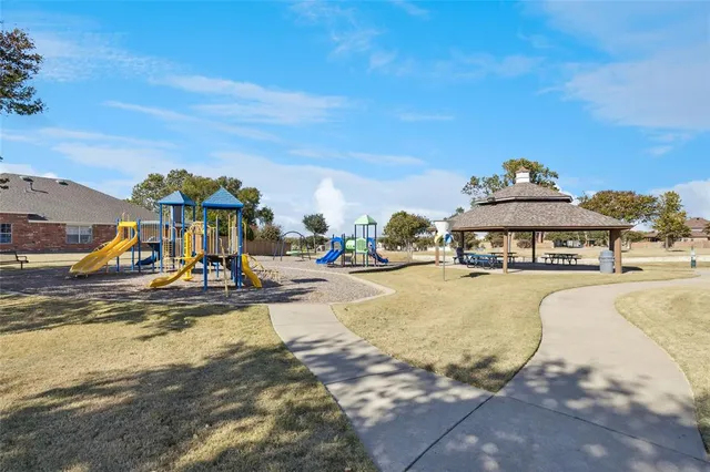 a view of a swimming pool with outdoor seating