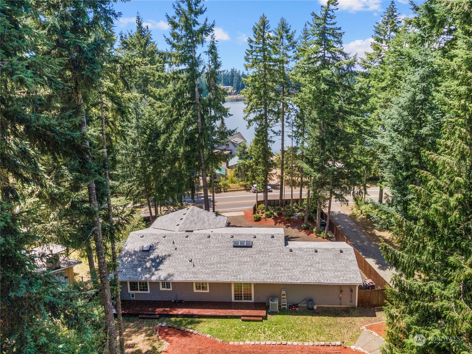 a view of a house with yard and sitting area