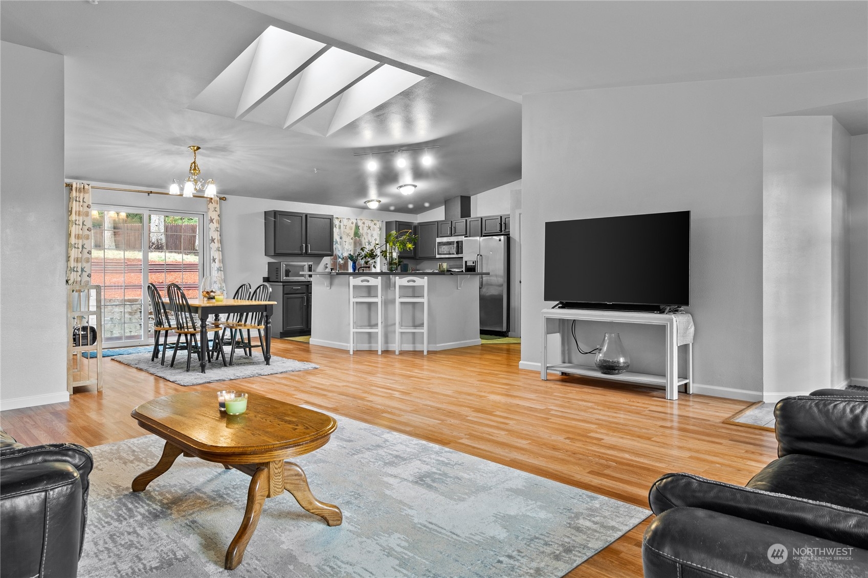 192 Gold Creek Road Northwest Bremerton, WA 98312 - Photo 13 of 38 a living room with furniture and a flat screen tv