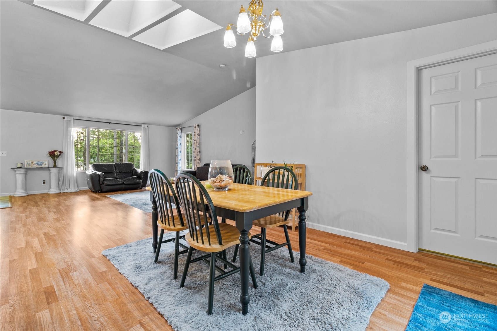 192 Gold Creek Road Northwest Bremerton, WA 98312 - Photo 15 of 38 a view of a dining room with furniture and wooden floor