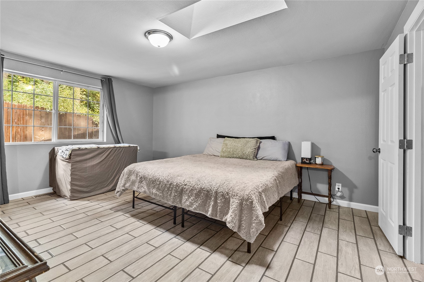 192 Gold Creek Road Northwest Bremerton, WA 98312 - Photo 20 of 38 a bedroom with a large bed and a balcony view