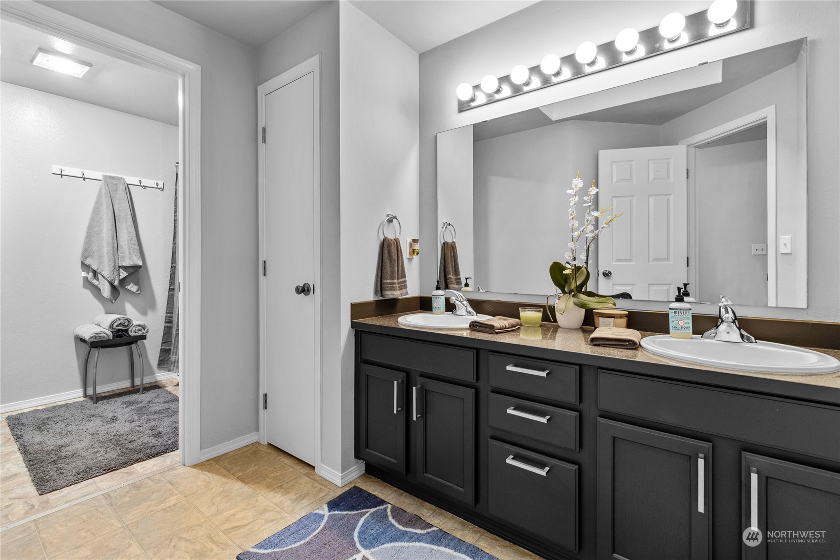 192 Gold Creek Road Northwest Bremerton, WA 98312 - Photo 28 of 38 a bathroom with a double vanity sink and a mirror