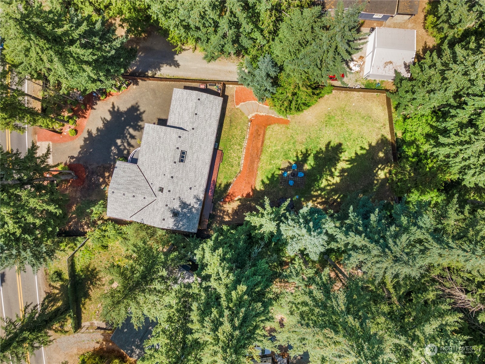 192 Gold Creek Road Northwest Bremerton, WA 98312 - Photo 31 of 38 an aerial view of a house with a yard and a large tree
