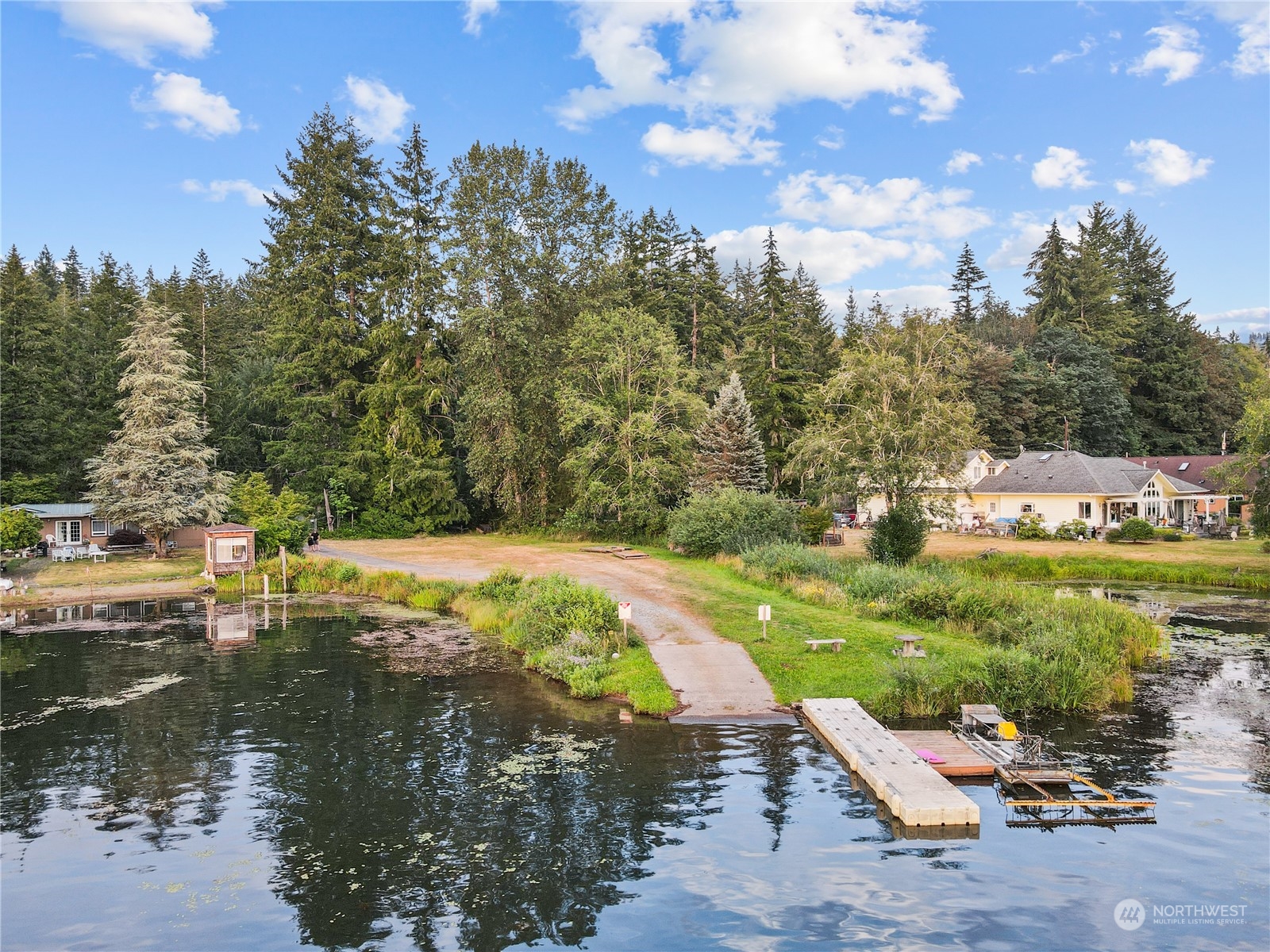 192 Gold Creek Road Northwest Bremerton, WA 98312 - Photo 37 of 38 a view of a lake with a yard