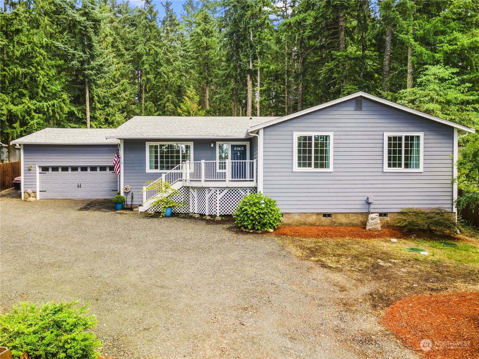 192 Gold Creek Road Northwest Bremerton, WA 98312 - Photo 4 of 38 a front view of a house with a yard and garage