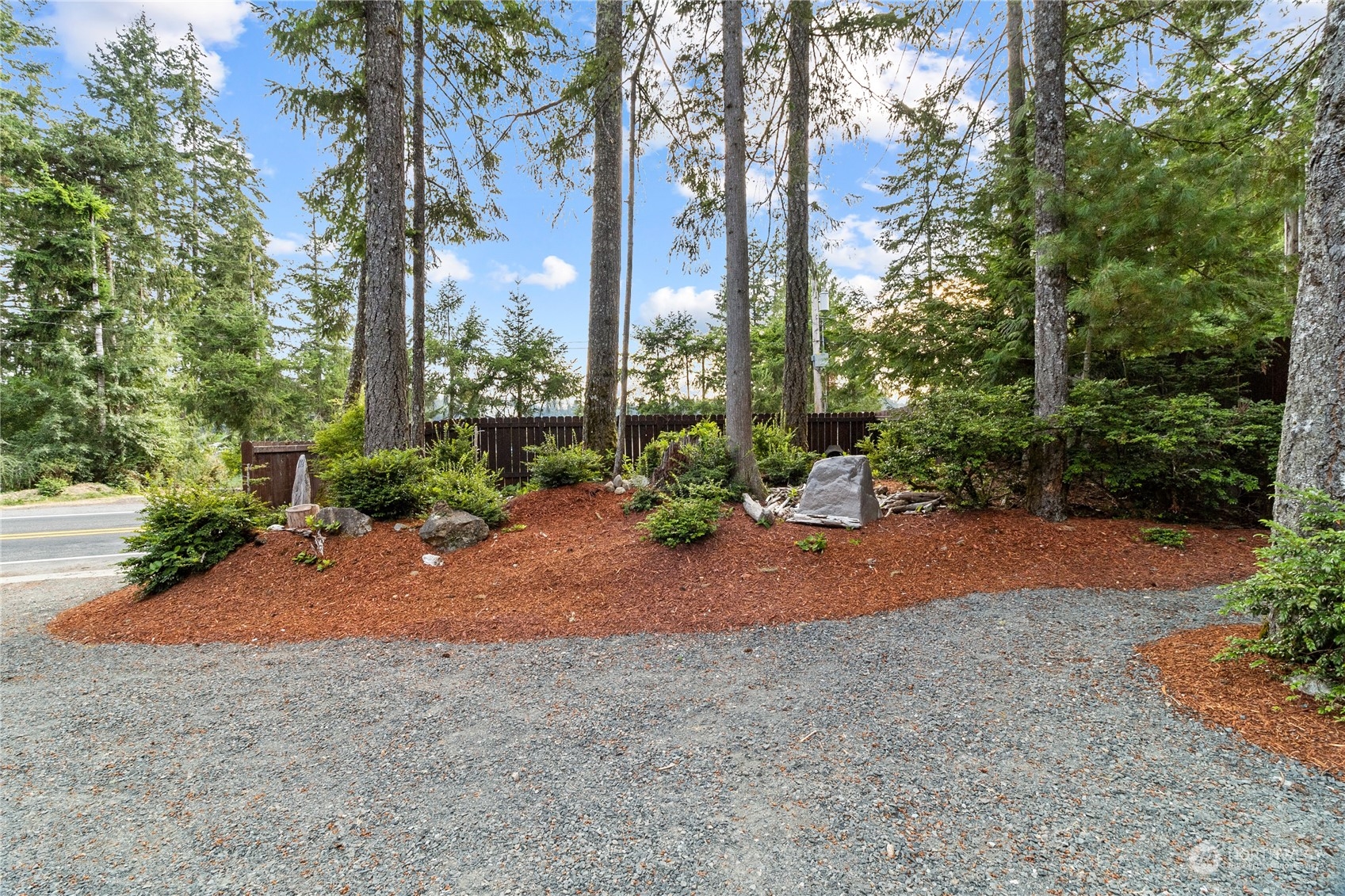 192 Gold Creek Road Northwest Bremerton, WA 98312 - Photo 6 of 38 a view of a field with trees around