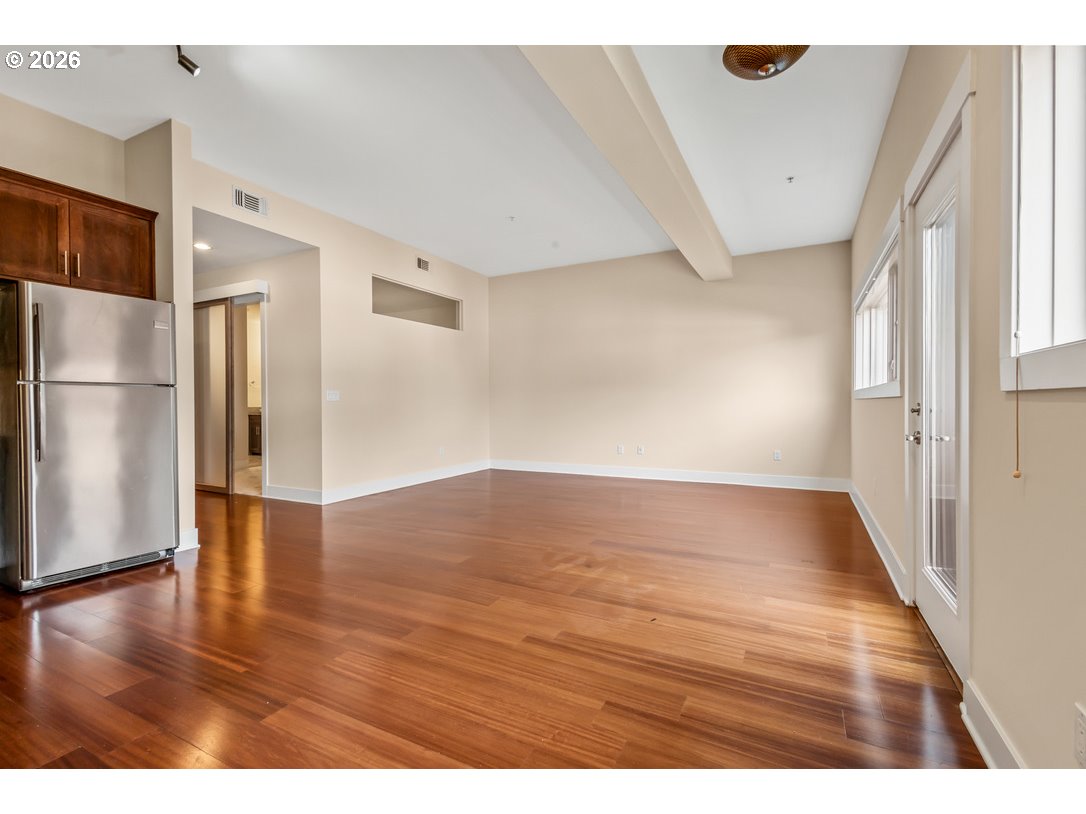 838 Southeast 38th Avenue, Unit 202 Portland, OR 97214 - Photo 16 of 34 a view of empty room with wooden floor