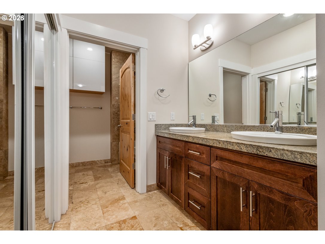 838 Southeast 38th Avenue, Unit 202 Portland, OR 97214 - Photo 20 of 34 a bathroom with a granite countertop sink mirror and a