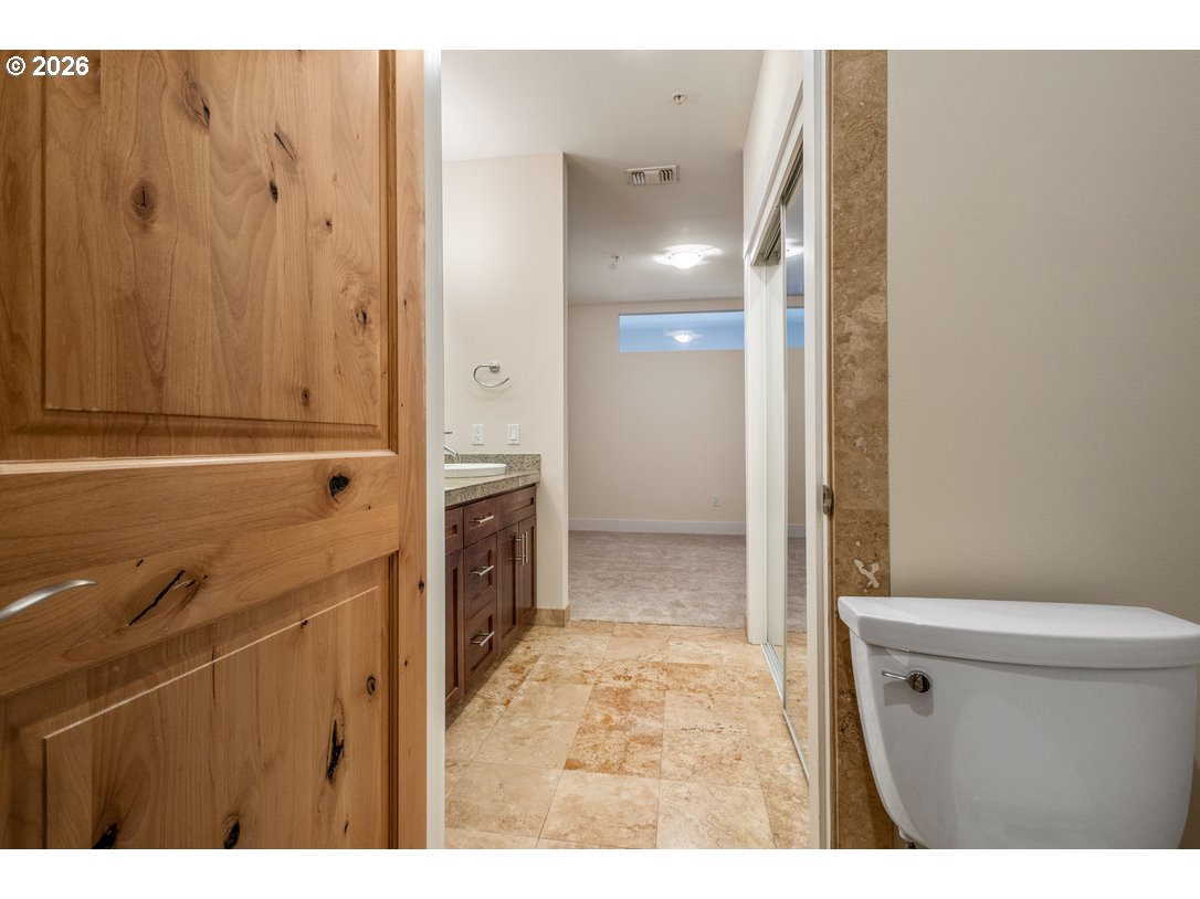 838 Southeast 38th Avenue, Unit 202 Portland, OR 97214 - Photo 21 of 34 a bathroom with a sink a toilet and shower