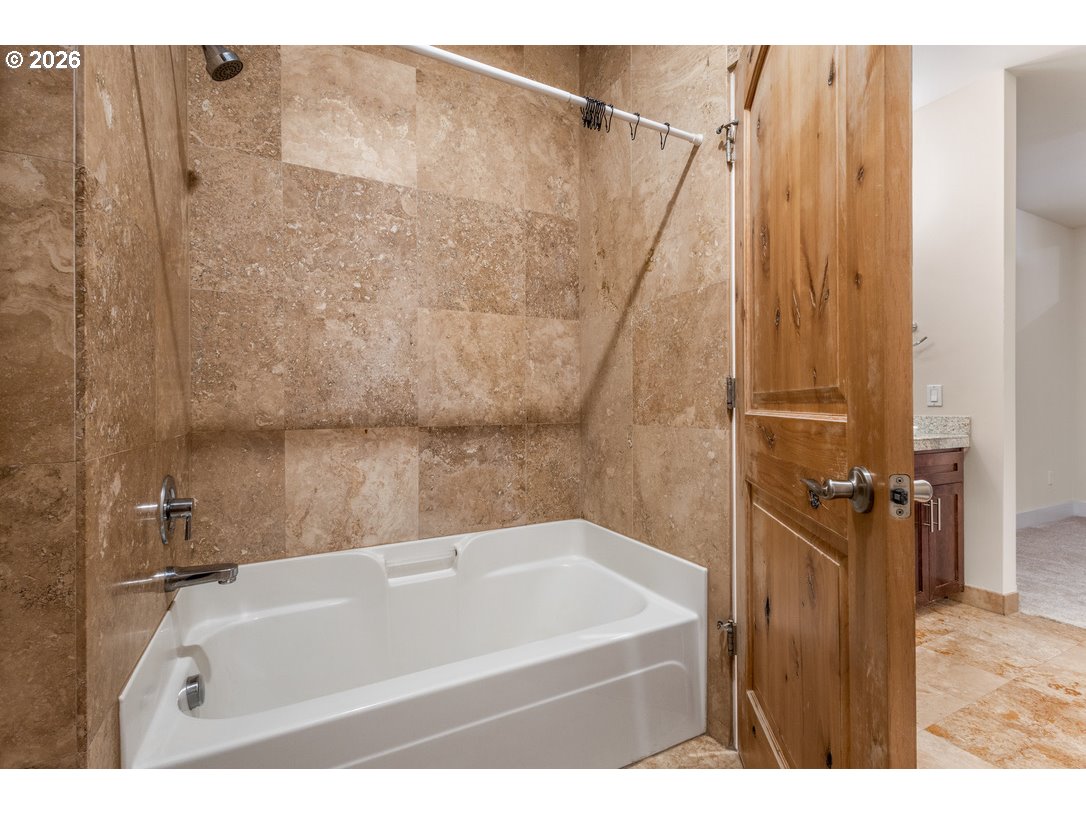 838 Southeast 38th Avenue, Unit 202 Portland, OR 97214 - Photo 25 of 34 a bathroom with a bathtub