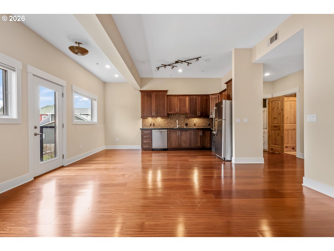 838 Southeast 38th Avenue, Unit 202 Portland, OR 97214 - Photo 9 of 34 a view interior of a house kitchen wooden floor and windows