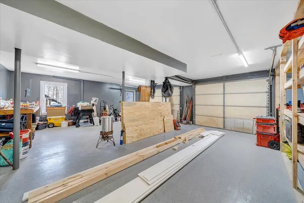 a bedroom with furniture and a wooden floor