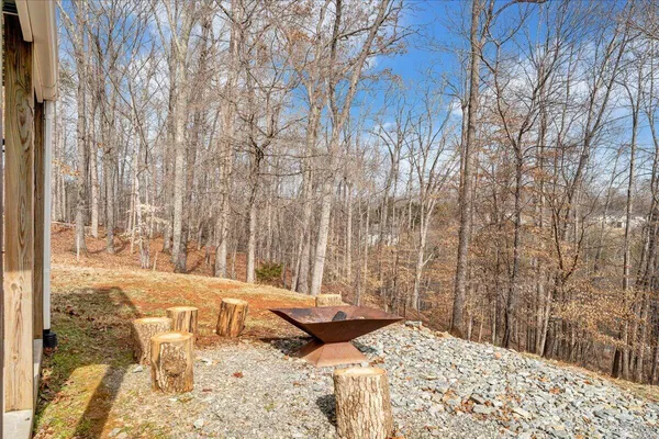 a view of backyard with patio