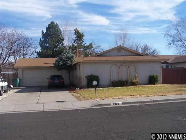 2990 Bobby Drive Reno, NV 89502 - Photo 1 of 1 a house with trees in front of it