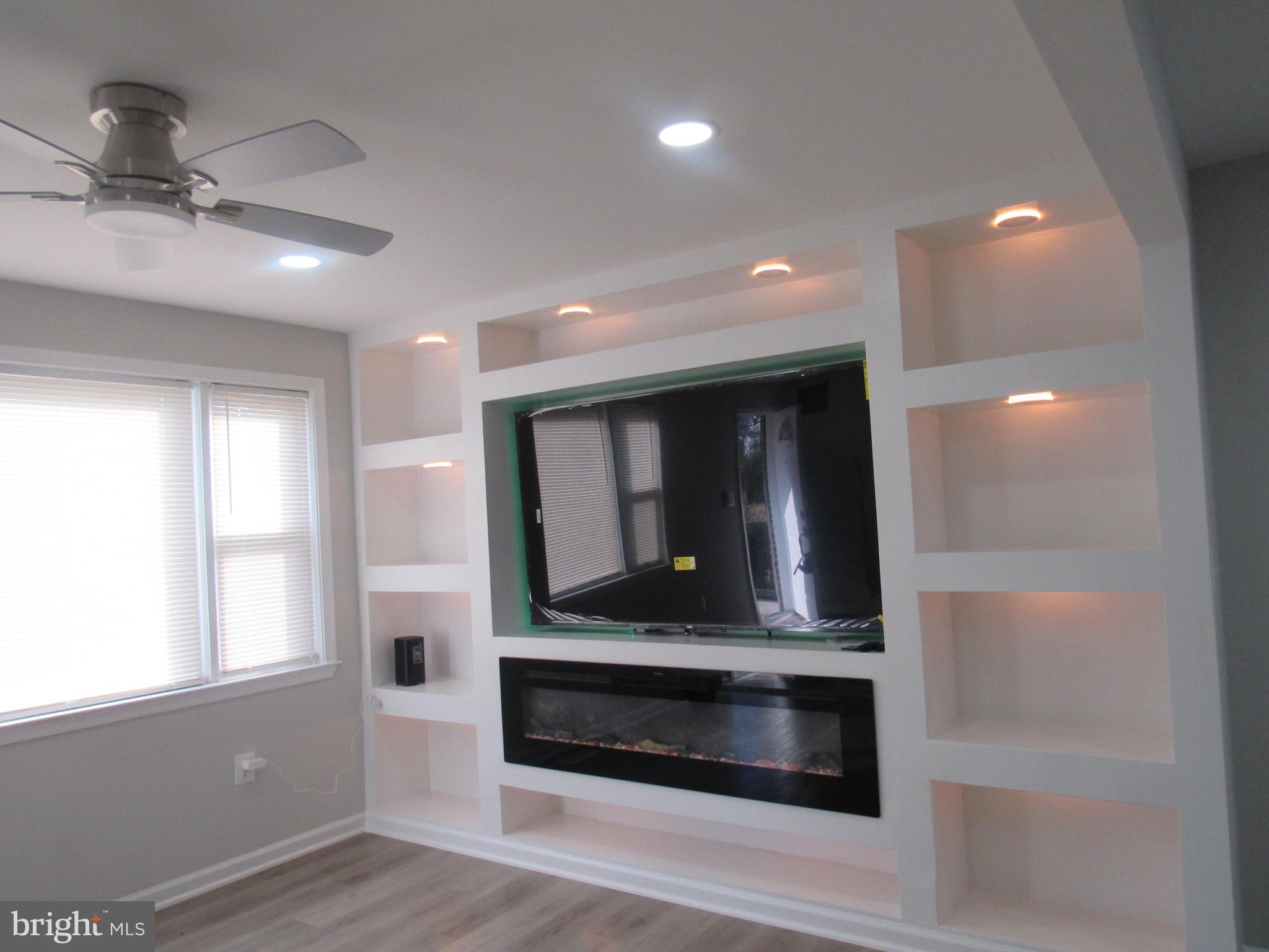 3515 Springdale Avenue District Heights, MD 20747 - Photo 3 of 16 a hallway with fireplace and window