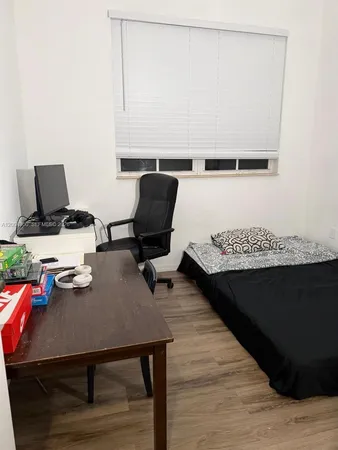 a living room with chair and a table