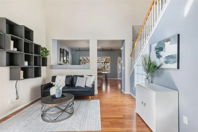 a living room with furniture and a potted plant