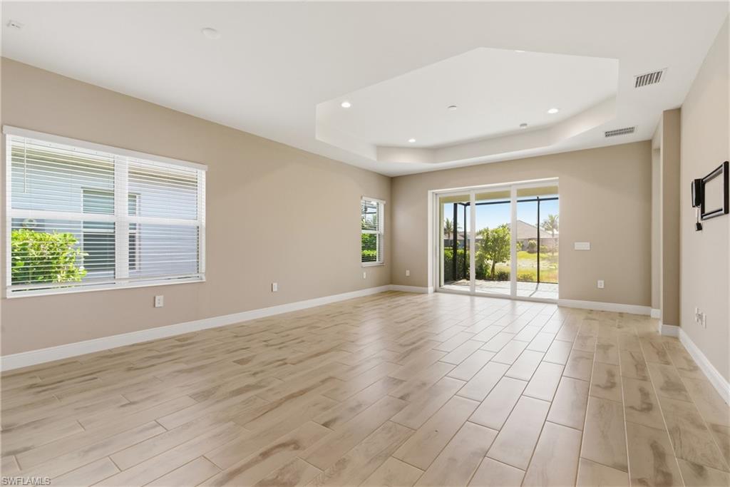 2118 Marquesa Circle Naples, FL 34112 - Photo 21 of 50 a view of an empty room with glass door