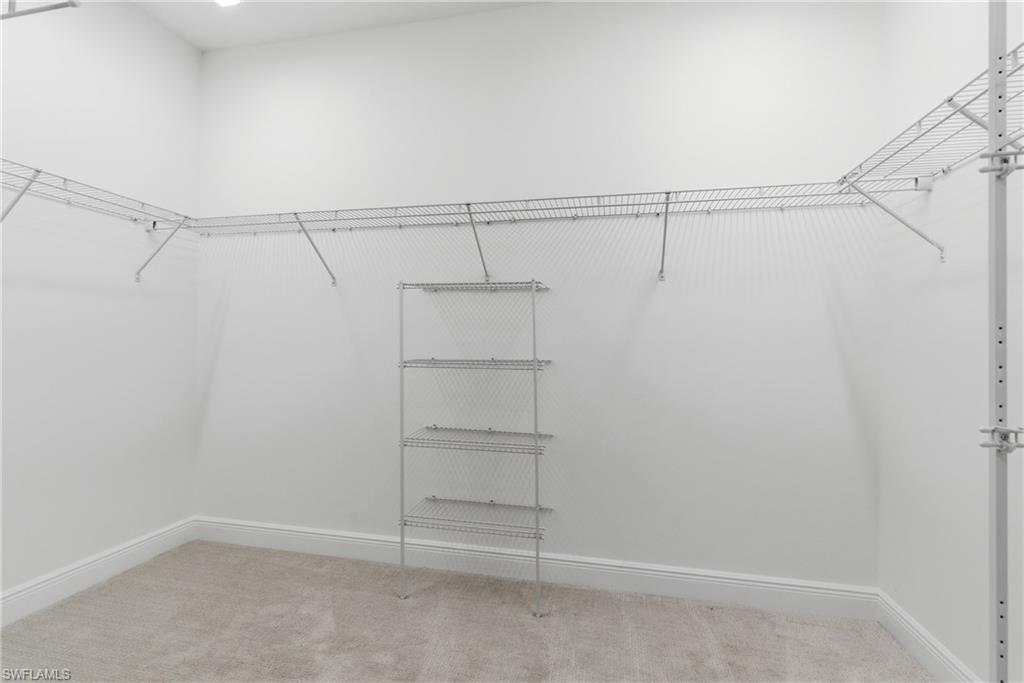 2118 Marquesa Circle Naples, FL 34112 - Photo 38 of 50 a view of an empty walk in closet