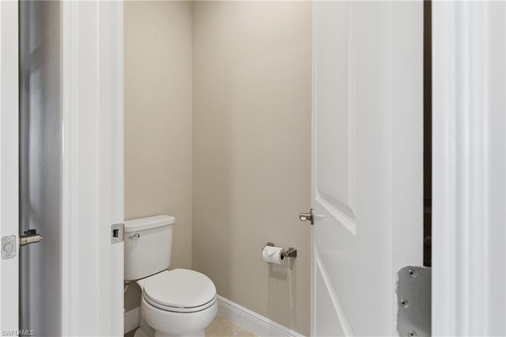 2118 Marquesa Circle Naples, FL 34112 - Photo 39 of 50 a white toilet sitting next to a shower