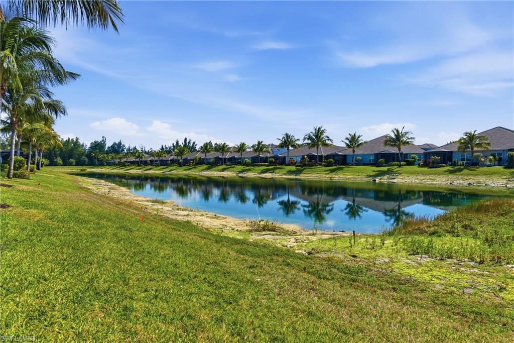 2118 Marquesa Circle Naples, FL 34112 - Photo 4 of 50 a view of a lake with houses in the back