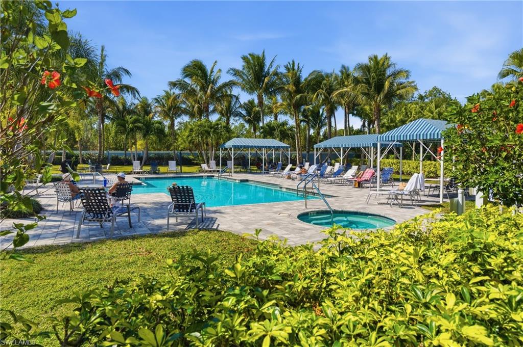 2118 Marquesa Circle Naples, FL 34112 - Photo 43 of 50 a swimming pool with outdoor seating and yard