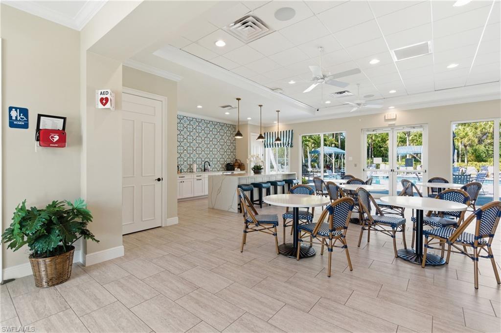 2118 Marquesa Circle Naples, FL 34112 - Photo 47 of 50 a large dining space with furniture window and wooden floor