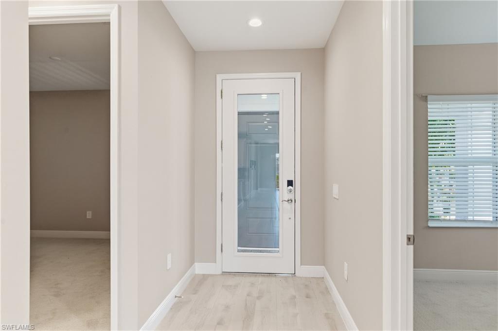 2118 Marquesa Circle Naples, FL 34112 - Photo 5 of 50 a view of a bathroom with a glass door