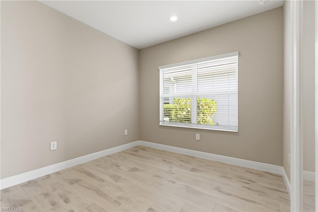 2118 Marquesa Circle Naples, FL 34112 - Photo 6 of 50 an empty room with a window