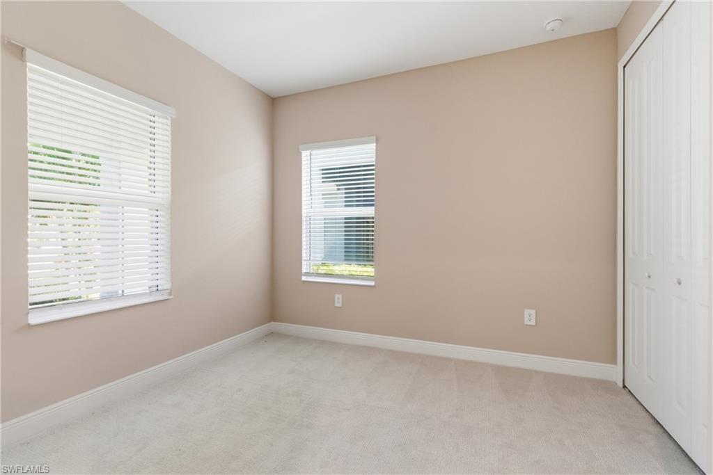 2118 Marquesa Circle Naples, FL 34112 - Photo 8 of 50 a view of an empty room with a window