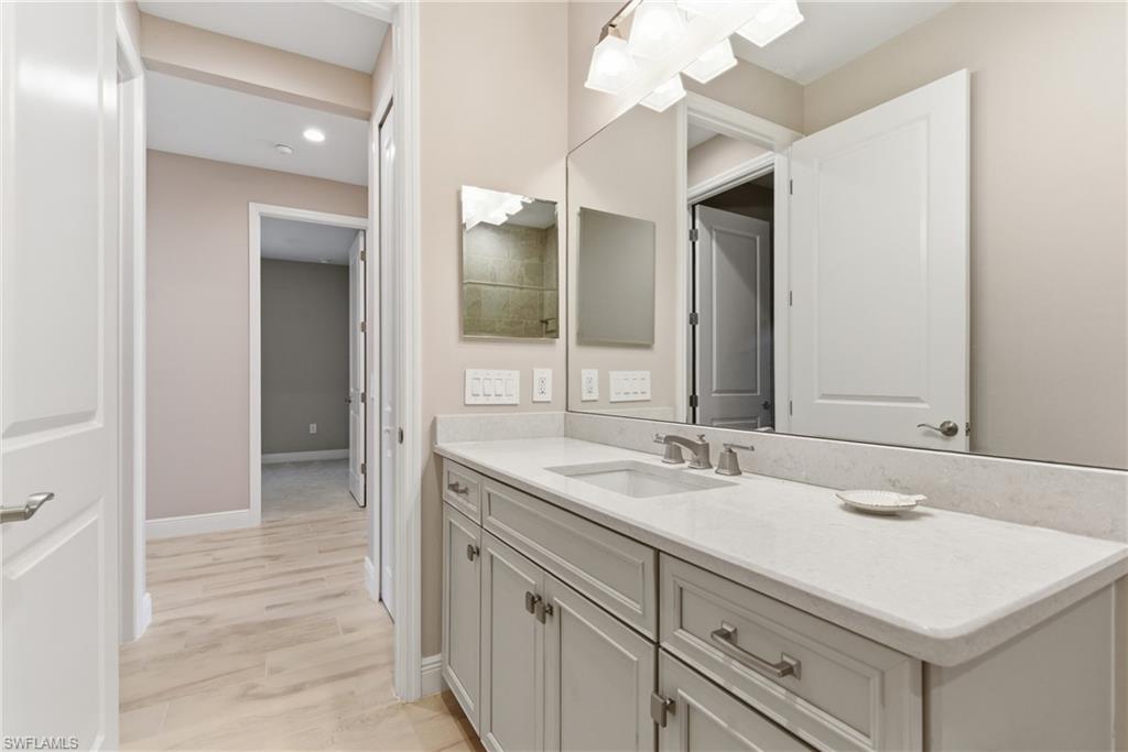 2118 Marquesa Circle Naples, FL 34112 - Photo 10 of 50 a bathroom with a sink and a mirror