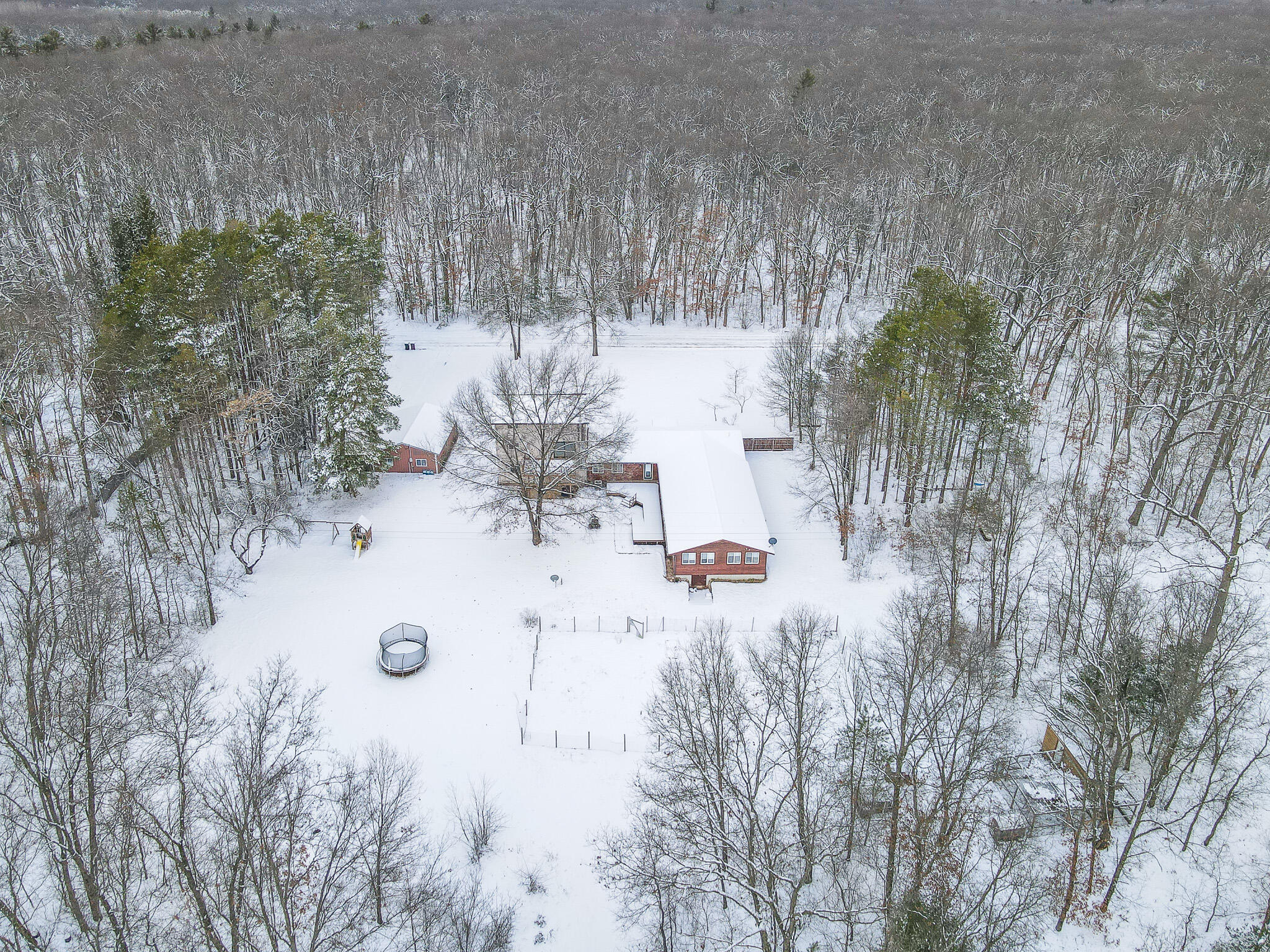871 East McKinley Road Rothbury, MI 49452 - Photo 2 of 64 dji_fly_20240215_164028_735_170803325097
