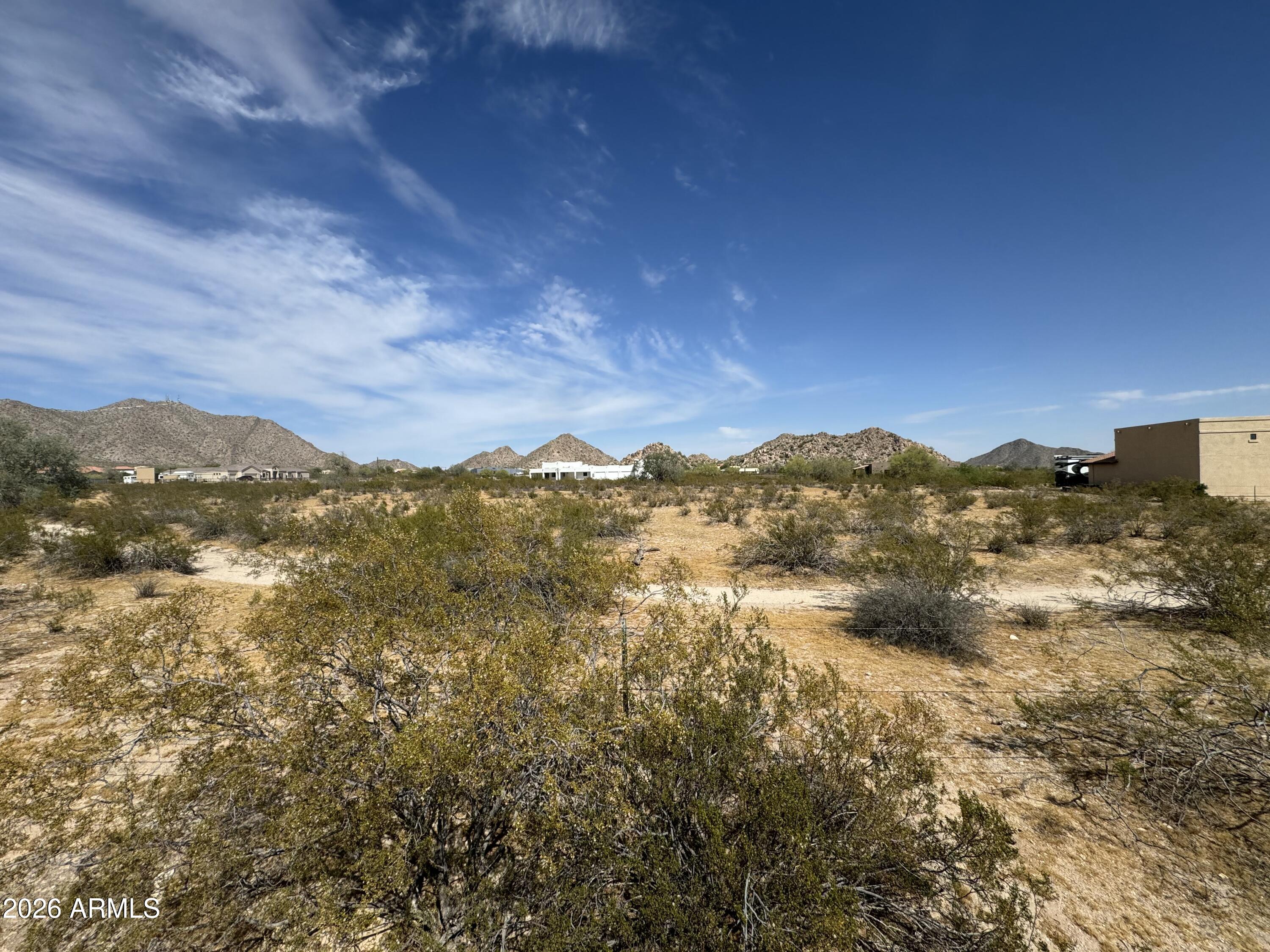 0 North Hazeldine Road, Unit C Casa Grande, AZ 85194 - Photo 6 of 7 a view of a houses with mountains in the background