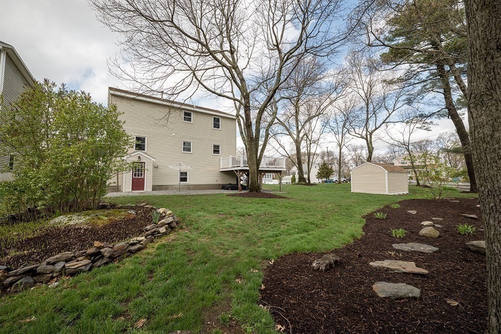 21 Swan Lane Billerica, MA 01821 - Photo 35 of 41 a view of a white house with a yard