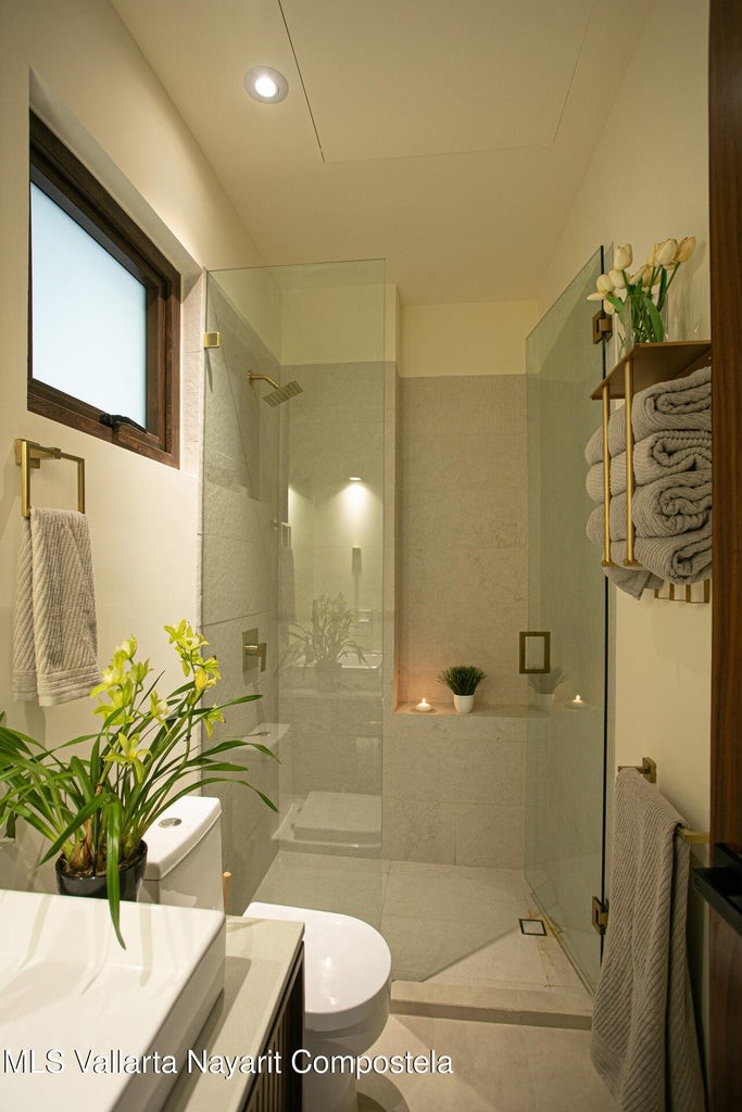 263 Calle Roma, Unit 504 Davisburg, undefined 48350 - Photo 14 of 25 a bathroom with a granite countertop sink a toilet and shower