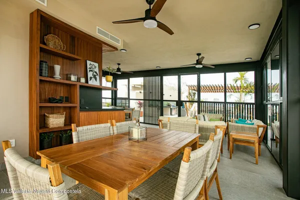 a view of a dining room with furniture window and outside view