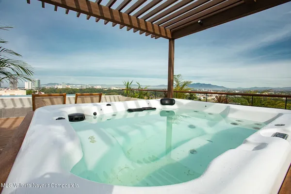 a view of swimming pool with seating area