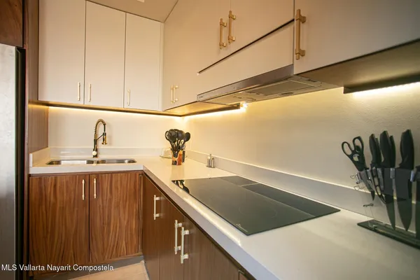 a kitchen with a sink and a window