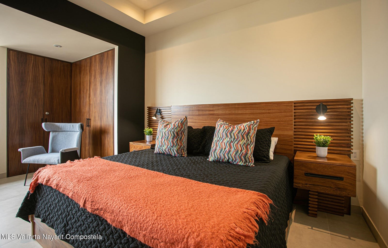 263 Calle Roma, Unit 504 Davisburg, undefined 48350 - Photo 9 of 25 a bed sitting in a bedroom next to a wooden cabinet