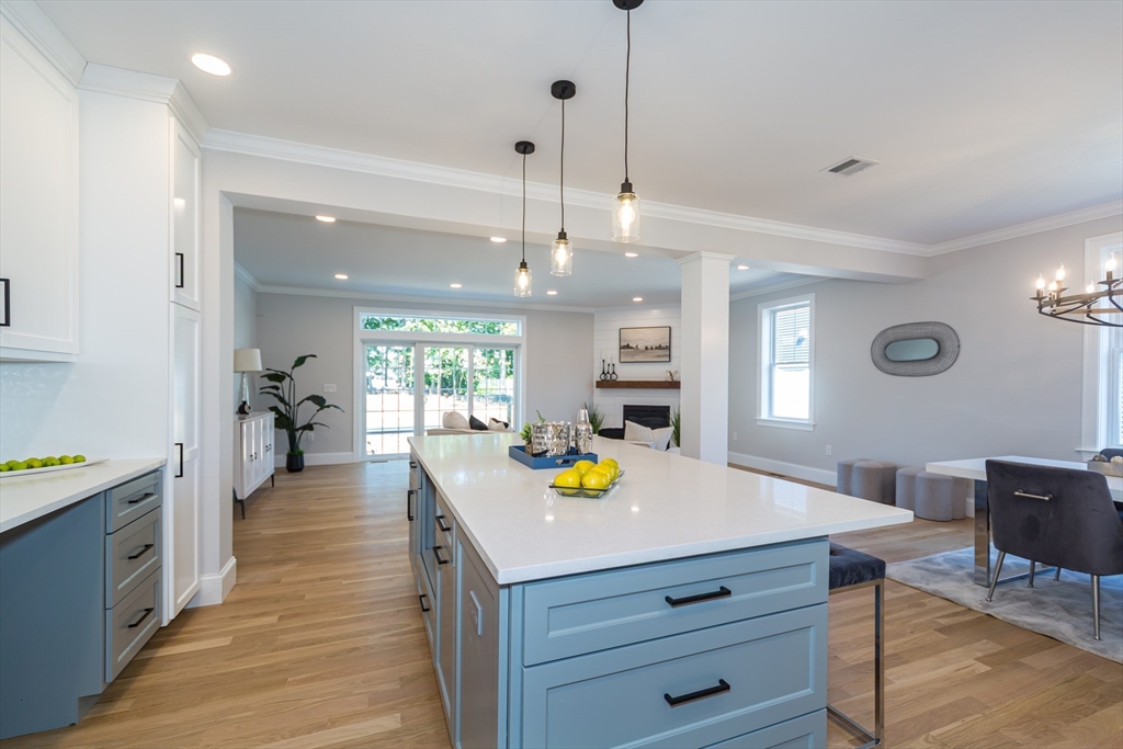 293 Bacon Street, Unit A Natick, MA 01760 - Photo 12 of 35 a kitchen that has a lot of cabinets in it