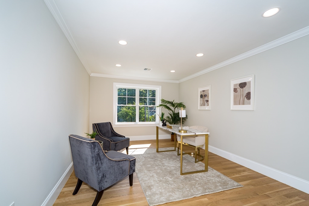 293 Bacon Street, Unit A Natick, MA 01760 - Photo 19 of 35 a living room with furniture and a potted plant