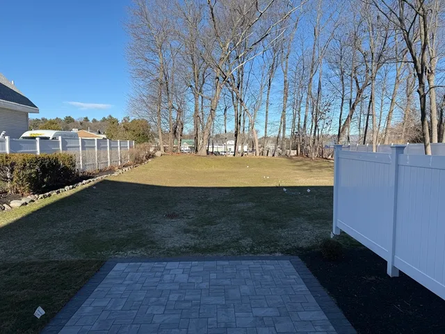 a view of outdoor space with swimming pool and trees