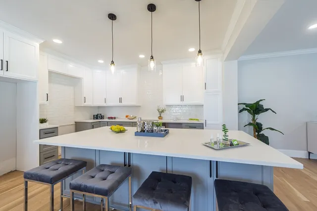 a kitchen with a table and chairs in it