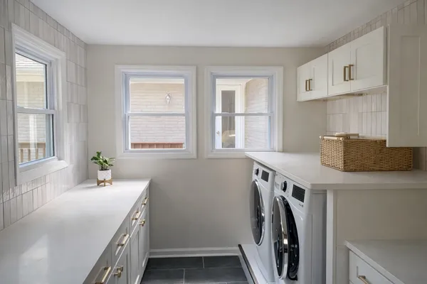 a utility room with a window dryer and washer