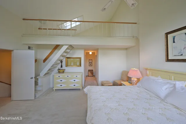 a bedroom with a bed and a cabinets