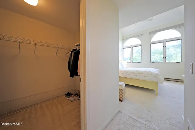a en suite bathroom with a granite countertop tub and a window