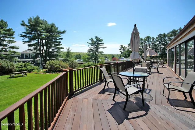 a view of a chairs and table on the deck