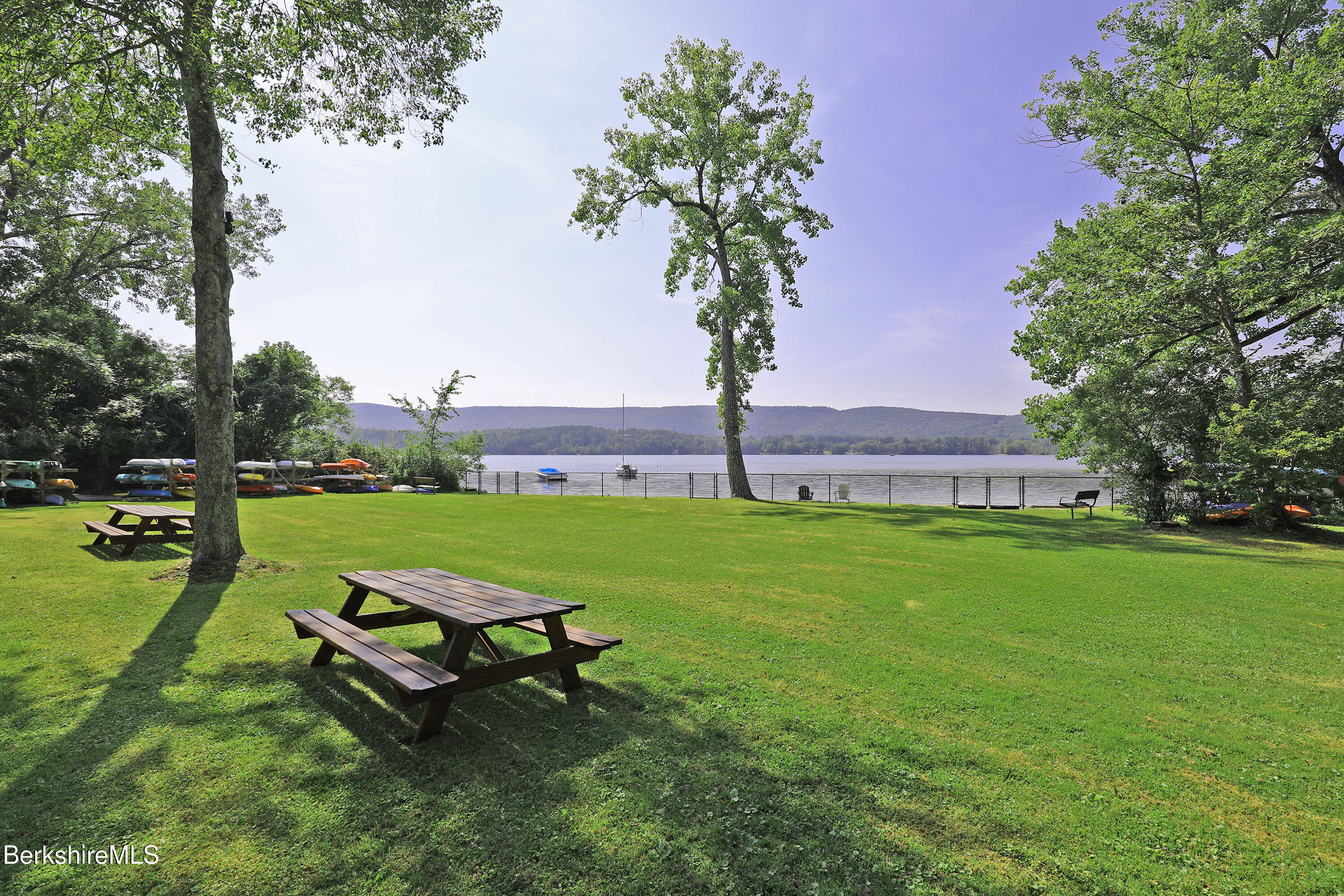 19 Hawthorne Road, Unit CARRIAGE BARN E2 Stockbridge, MA 01262 - Photo 46 of 47 a park with a bench and trees