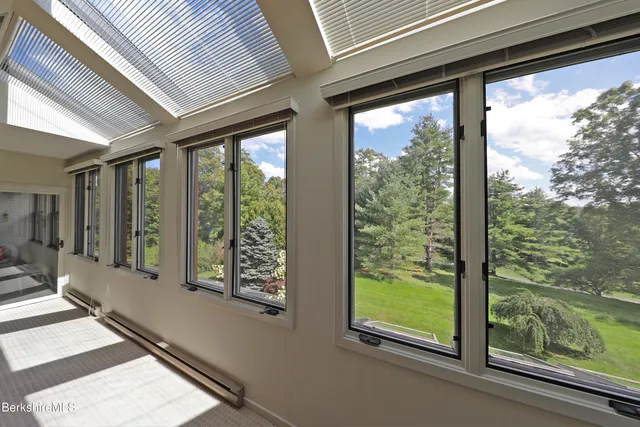 a view of a porch with a floor to ceiling window